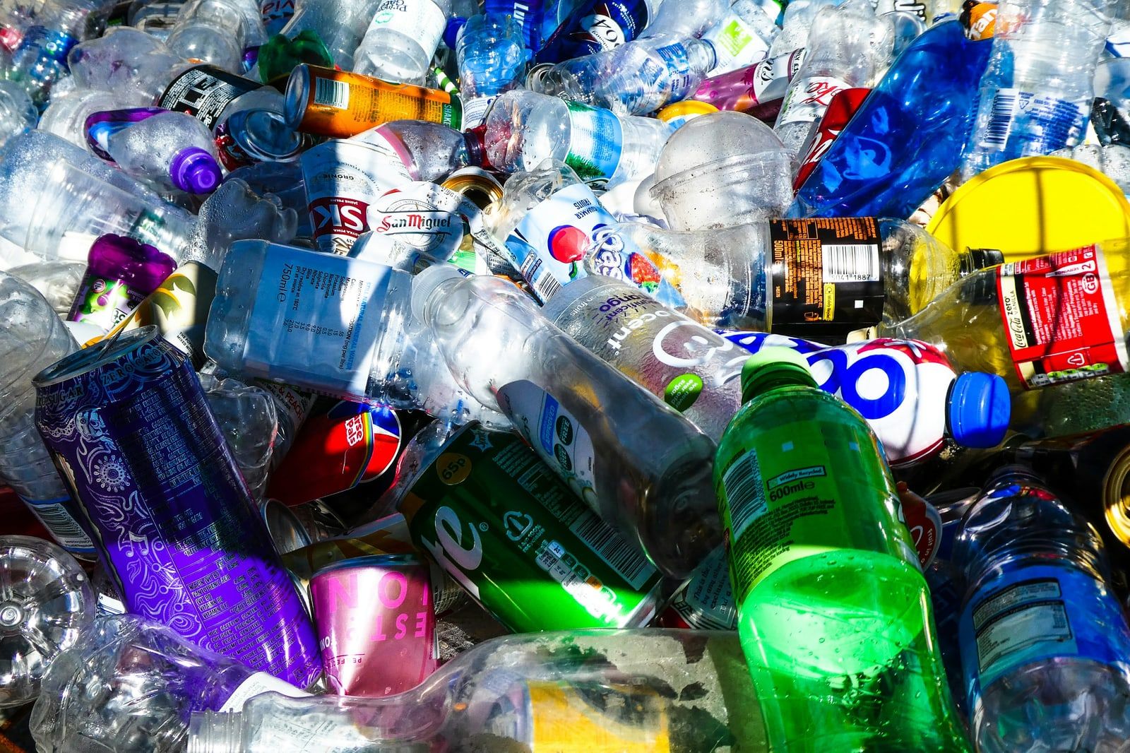 A pile of colourful used plastic bottles awaiting recycling
