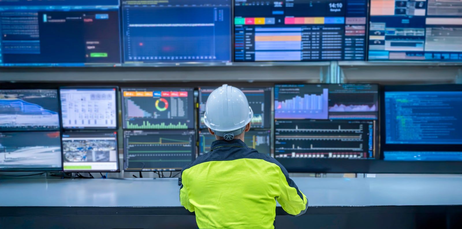 Engineer monitoring plant systems in a control room